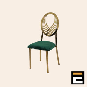 Chair with a modern gold design and green velvet seat.