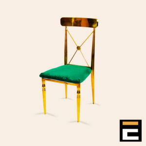 Gold chair with elegant cross-back and green velvet seat
