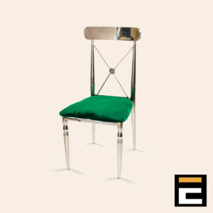 Silver chair with elegant cross-back and green velvet seat