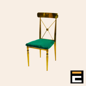 Gold chair with elegant cross-back and green velvet seat
